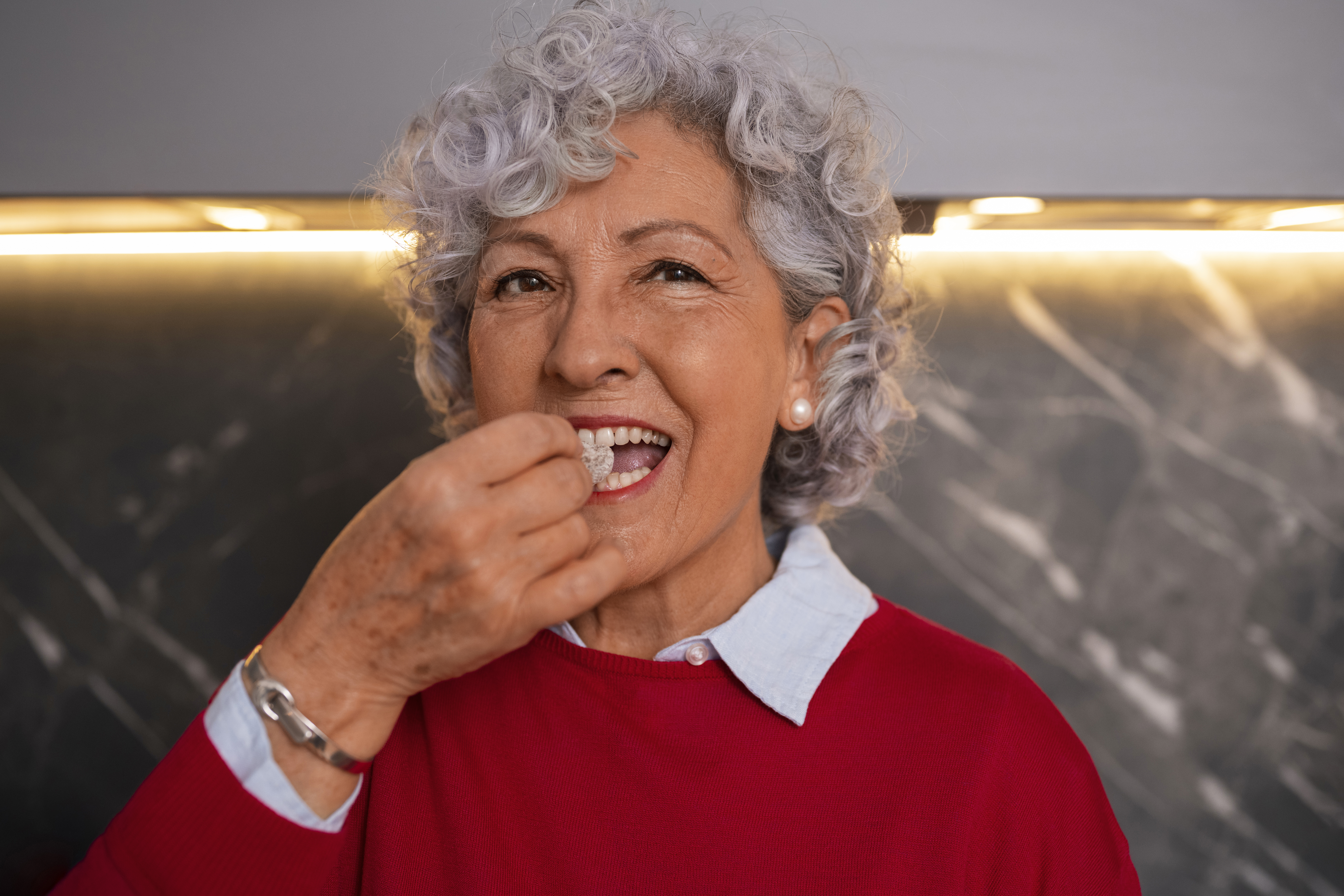 Smiling patient with new dentures
